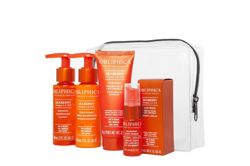 A travel kit containing four OBLIPHICA Seaberry hair care products for fine to medium textures, including shampoo, conditioner, hair mask, and hair serum in TSA-approved bottles.