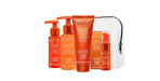 A travel kit containing four OBLIPHICA Seaberry hair care products for fine to medium textures, including shampoo, conditioner, hair mask, and hair serum in TSA-approved bottles.