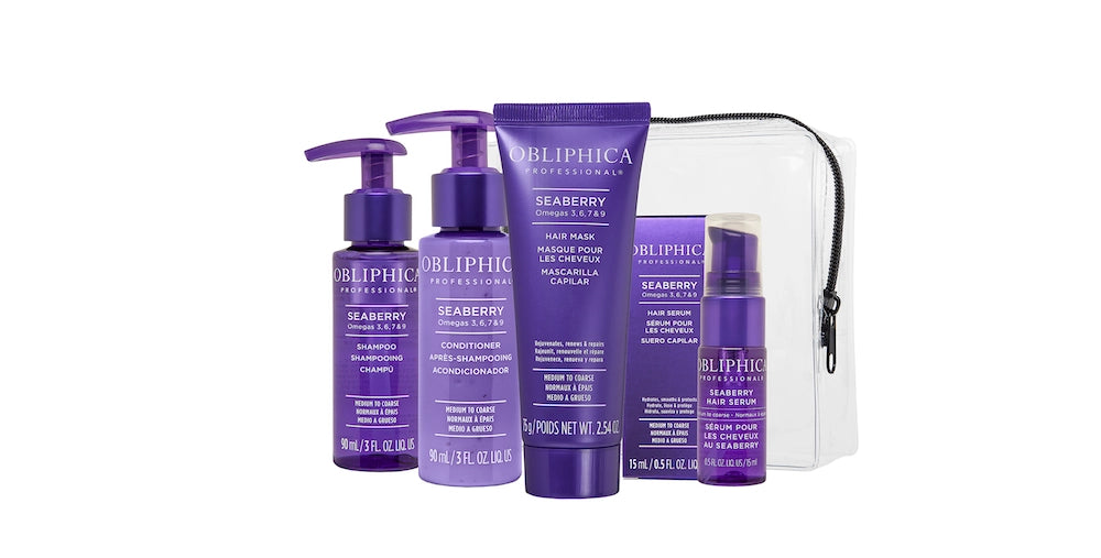 A travel kit containing four OBLIPHICA Seaberry hair care products for medium to coarse textures, including shampoo, conditioner, hair mask, and hair serum in TSA-approved bottles.